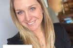 A woman with blonde hair wearing a black blazer with Madden Media's logo in the bottom left corner