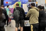 Attendees Looking at the Tourism Champions Booth at the Ottawa Outdoor + Adventure Travel Show